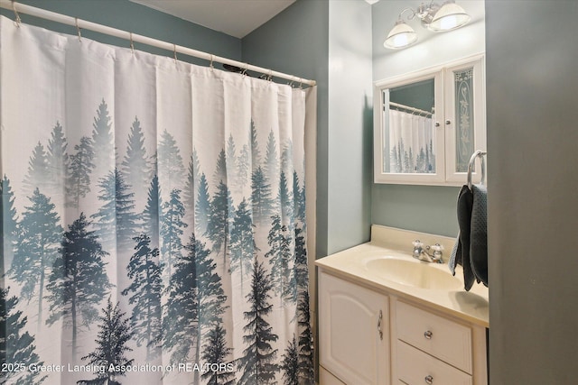 bathroom with vanity and a shower with shower curtain