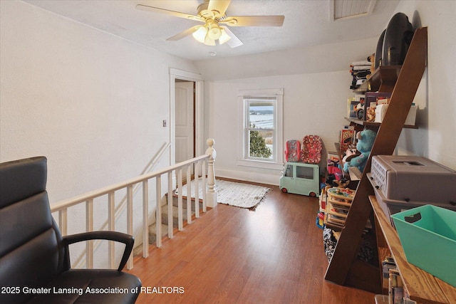 interior space with hardwood / wood-style flooring, ceiling fan, and lofted ceiling