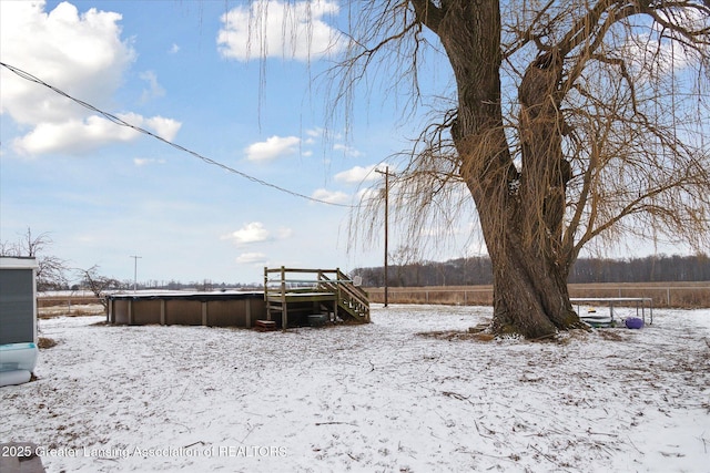 snowy yard with a pool