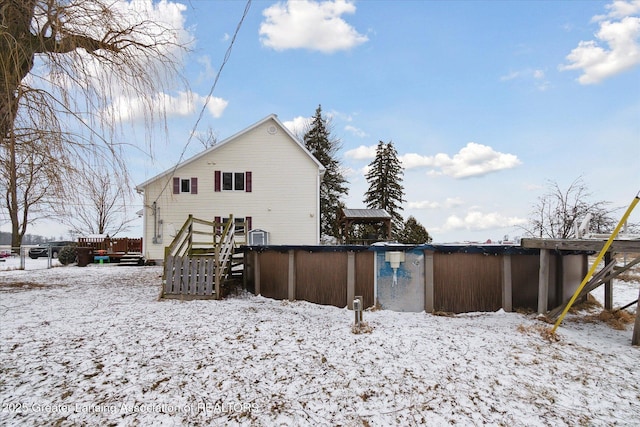 view of snow covered house