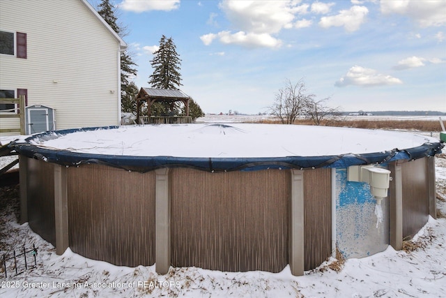 snow covered pool featuring a gazebo