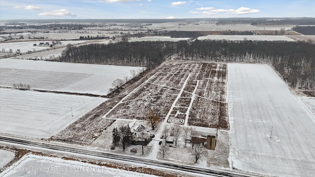 snowy aerial view featuring a rural view