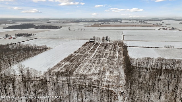 snowy aerial view with a rural view