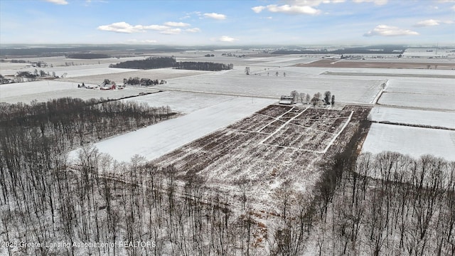 snowy aerial view with a rural view