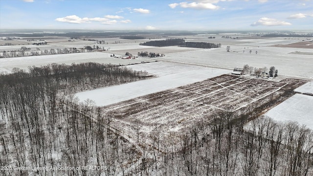 snowy aerial view featuring a rural view