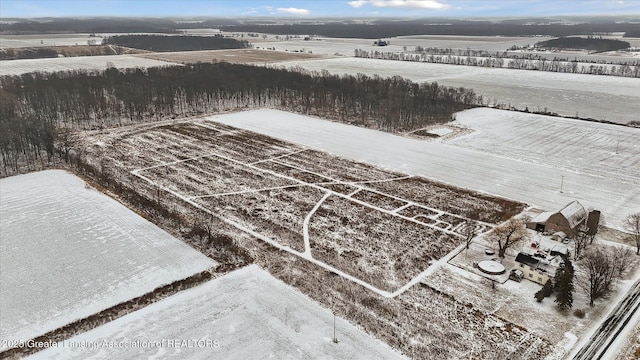 snowy aerial view with a rural view