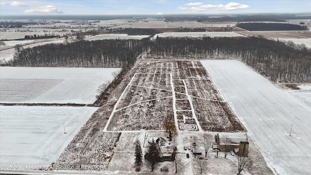 snowy aerial view with a rural view