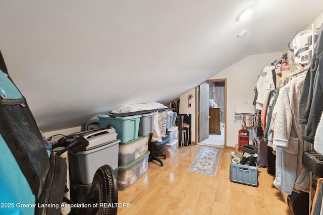 interior space featuring vaulted ceiling and light hardwood / wood-style flooring