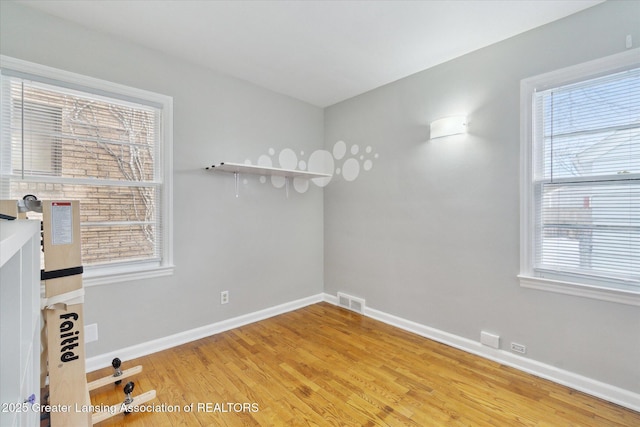 unfurnished room featuring hardwood / wood-style floors