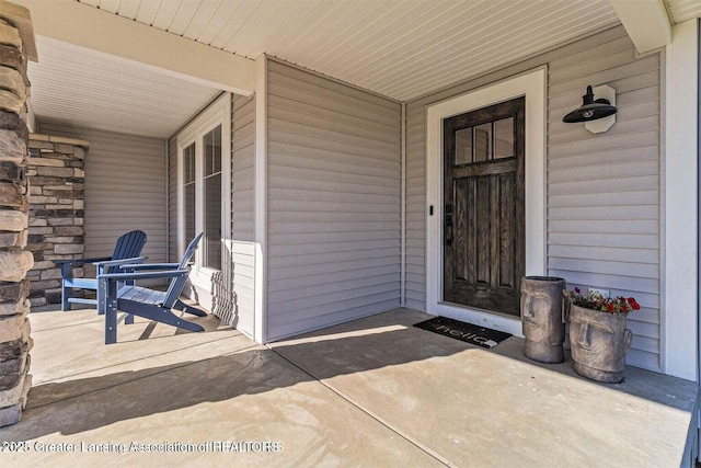 property entrance with covered porch