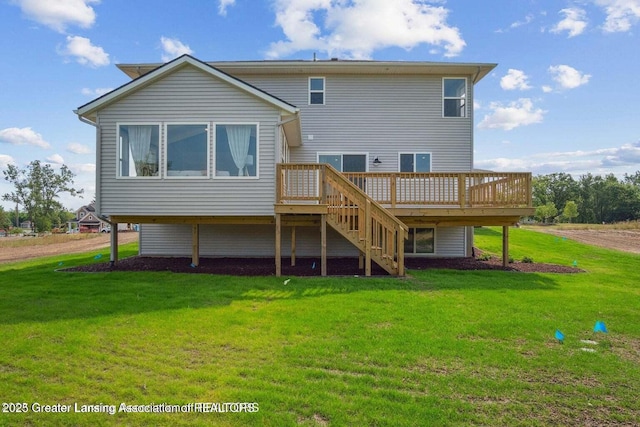 back of house with a wooden deck and a lawn