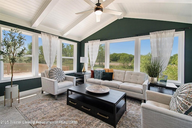 sunroom with lofted ceiling with beams, wooden ceiling, and ceiling fan