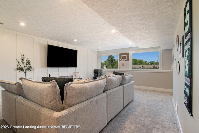 carpeted living room featuring a textured ceiling