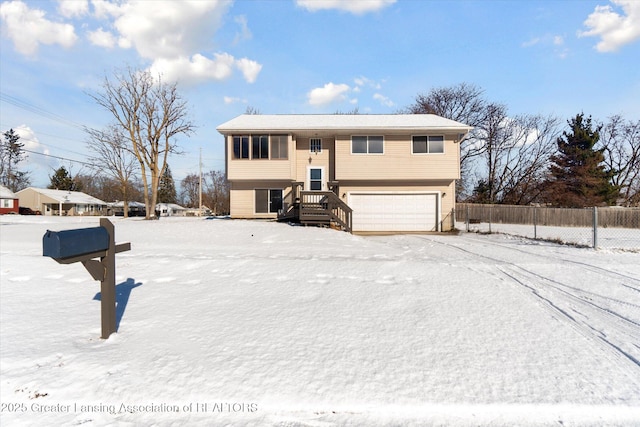 split foyer home featuring a garage