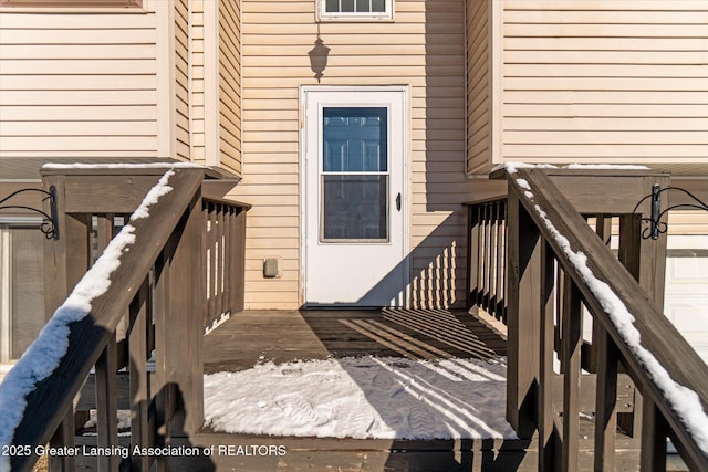 doorway to property featuring a wooden deck