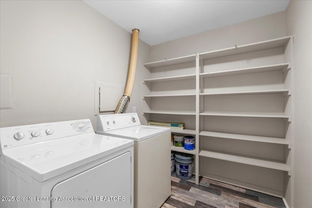 washroom with dark hardwood / wood-style floors and washer and dryer