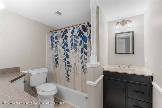 full bathroom with vanity, shower / bath combination with curtain, and toilet