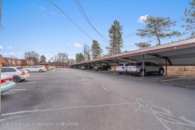 view of vehicle parking with a carport