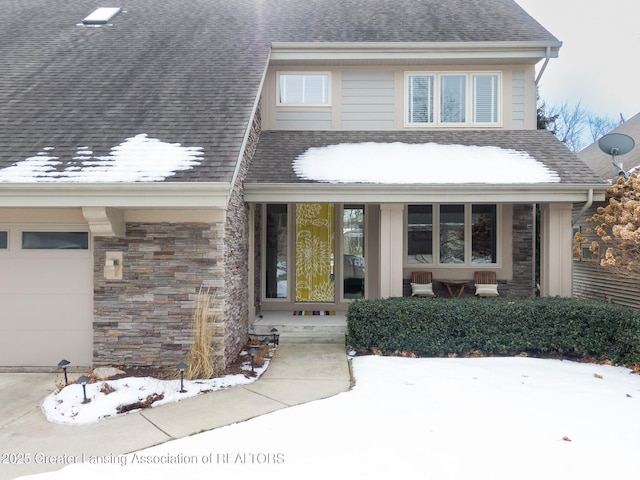 view of front of house with a garage and covered porch