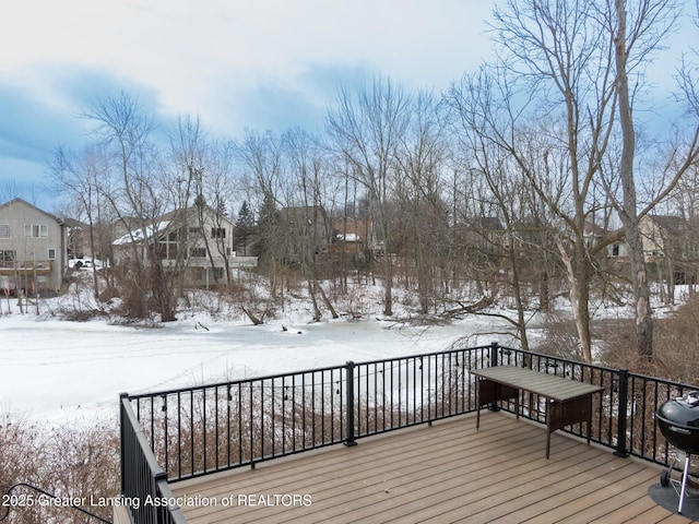 snow covered deck with area for grilling