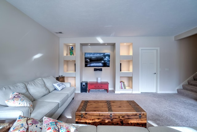 living room with carpet floors and built in features