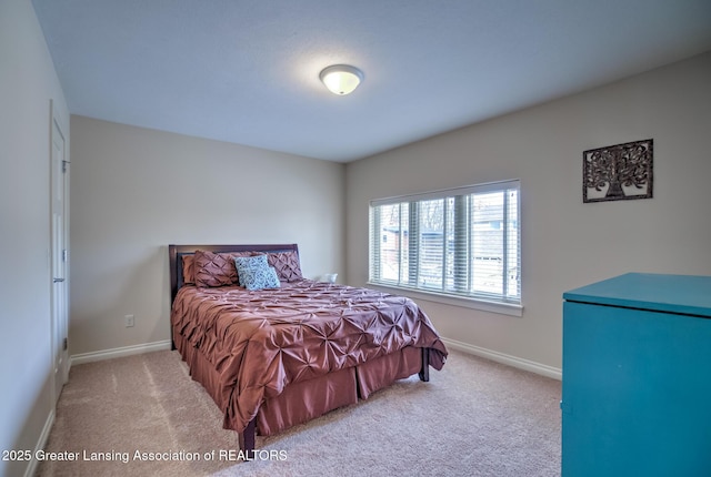 bedroom featuring light colored carpet