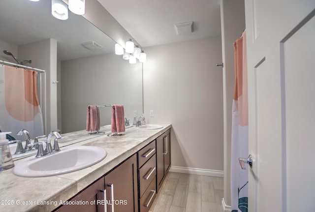 bathroom featuring vanity and hardwood / wood-style floors