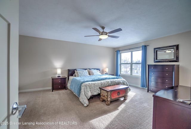 bedroom with light colored carpet and ceiling fan