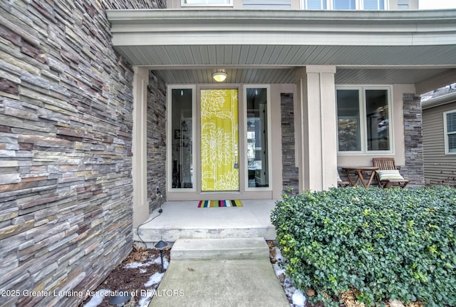 property entrance featuring a porch