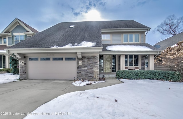 view of front of property with a porch and a garage