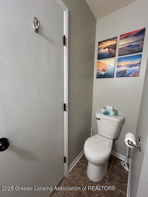 bathroom featuring tile patterned floors and toilet