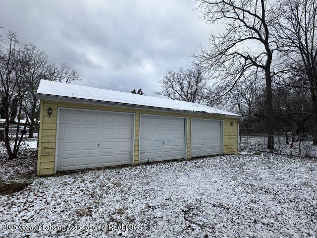 view of snow covered garage