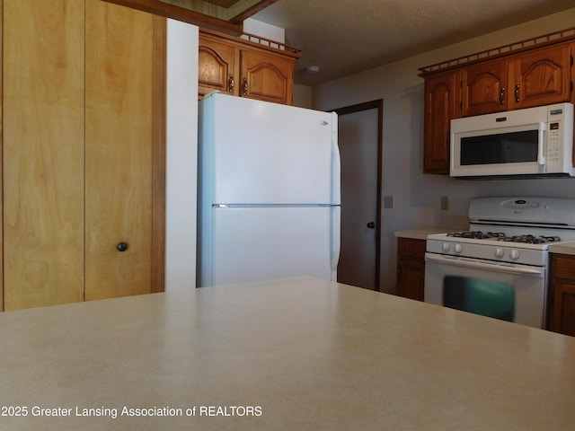 kitchen featuring white appliances