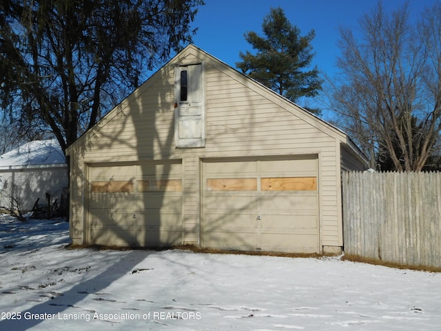 view of snow covered garage