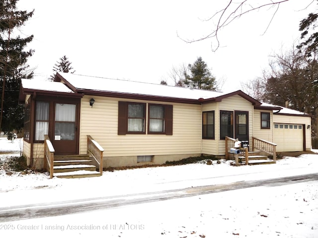 view of front of property with a garage