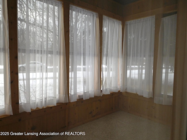 unfurnished sunroom with plenty of natural light