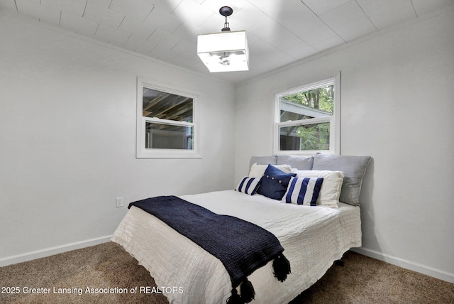 carpeted bedroom featuring ornamental molding