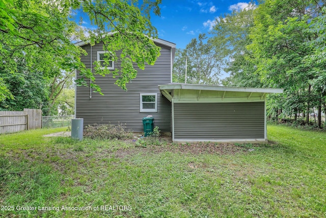 rear view of house with a yard