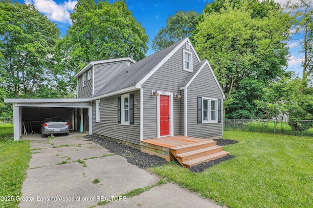 view of front of house with a carport and a front lawn