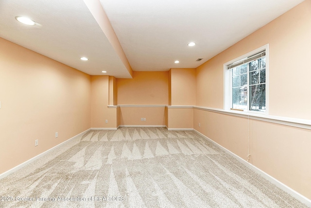 empty room with light colored carpet