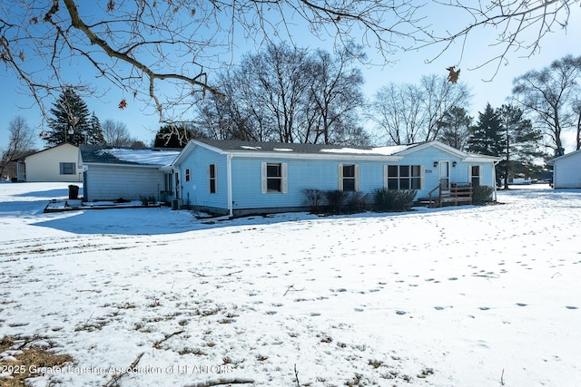 view of snow covered house