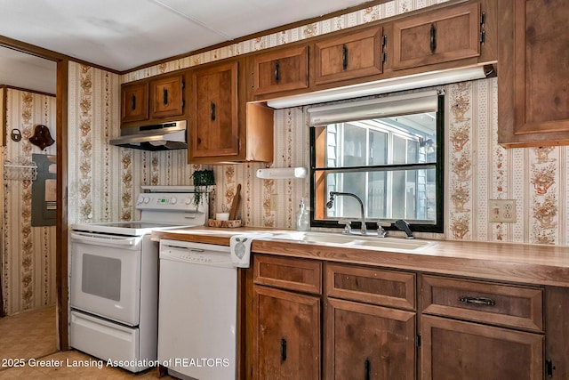 kitchen featuring sink and white appliances