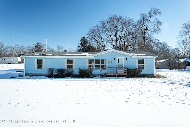 view of snow covered property