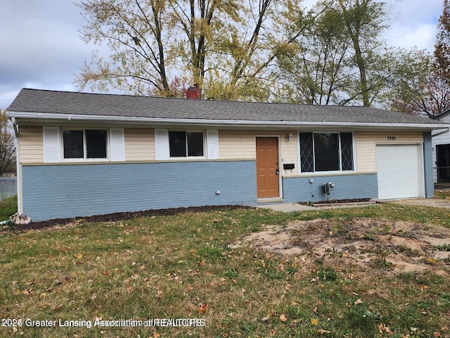 single story home with a garage and a front lawn