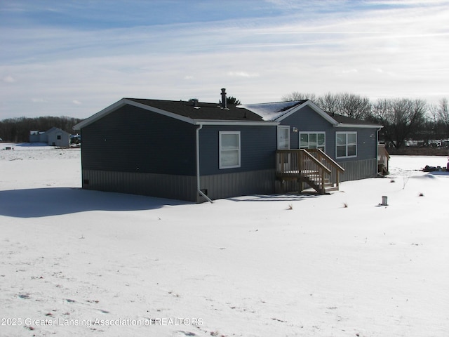 view of snow covered property