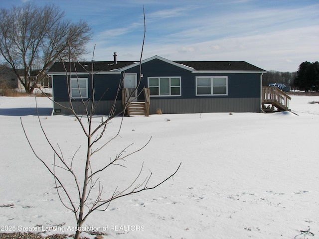 view of snow covered property