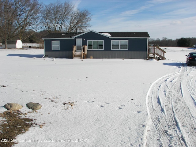 view of snow covered house