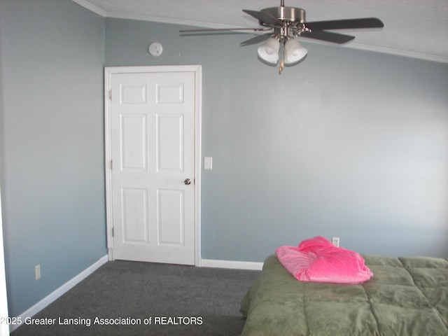 unfurnished bedroom featuring ornamental molding, carpet flooring, and ceiling fan