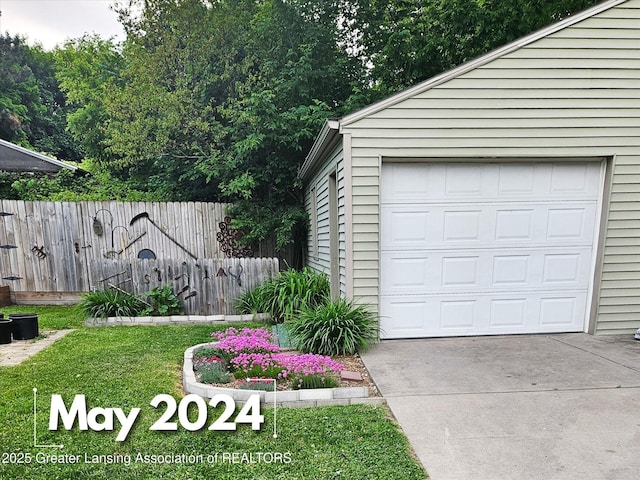 garage with a lawn