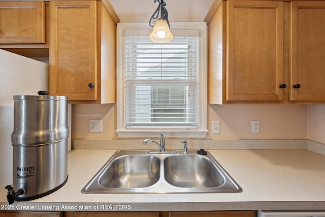 kitchen with sink and decorative light fixtures